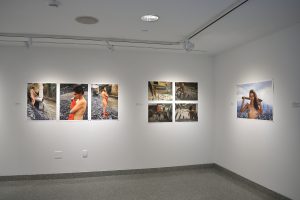 Installation view of eight photographs.
