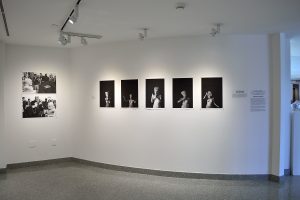 Installation view of seven black and white photographs.