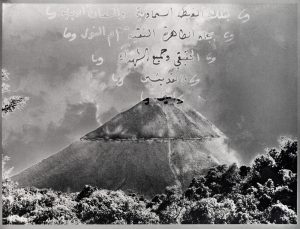 Black and white image of tress and volcano with text coming out.