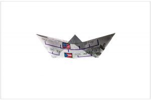 White origami boat with purple lines and flags.