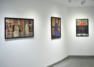 Installation view of three photographs with black frames, figure, heart and seismic register lines.